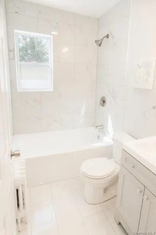 a front view of a house with a yard and pathway