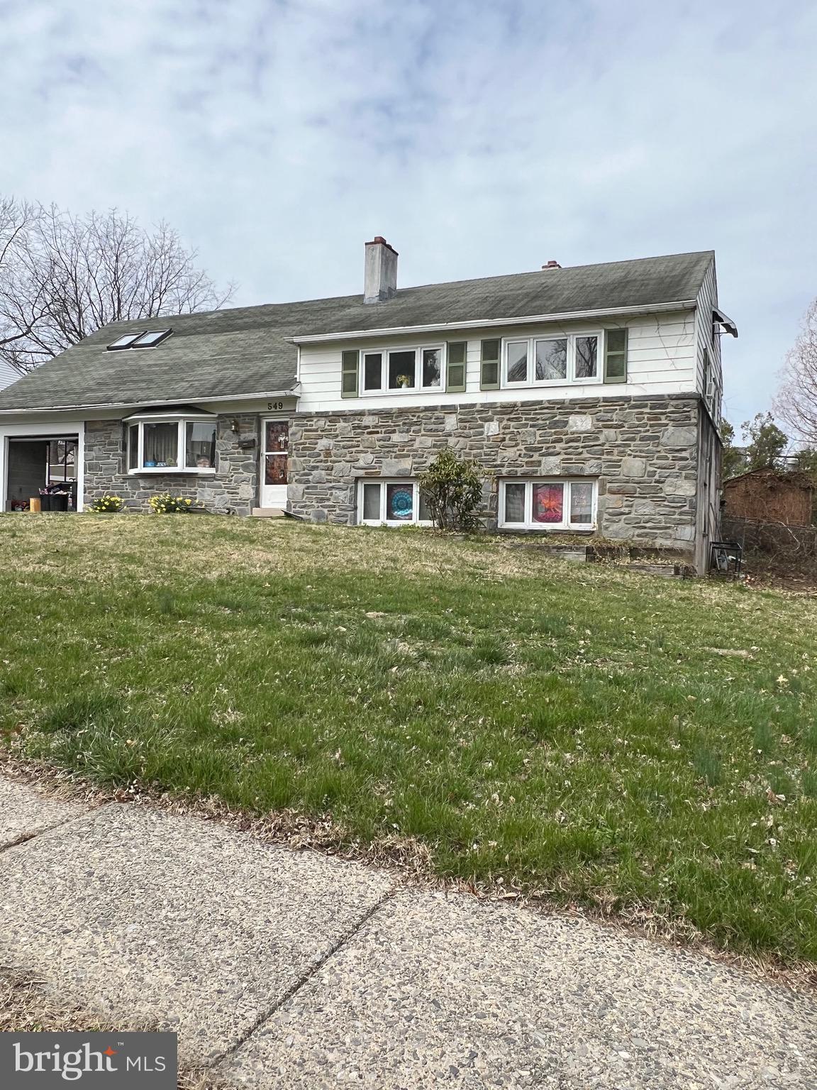 549 General Learned Road King of Prussia, PA 19406 - Photo 2 of 31 a front view of a house with a garden