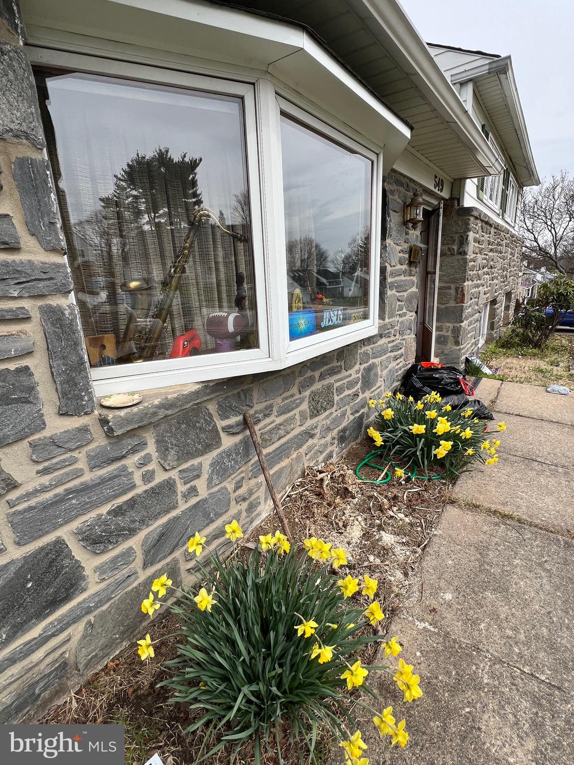 549 General Learned Road King of Prussia, PA 19406 - Photo 3 of 31 a vase of flowers sitting in front of a door