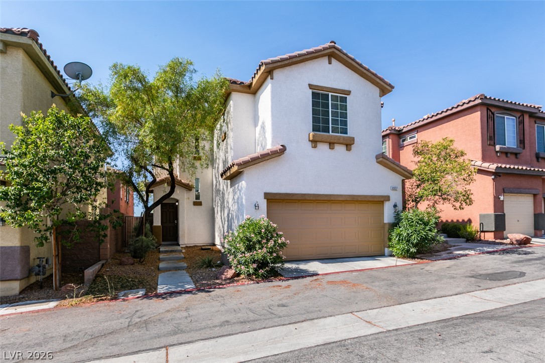 8937 Caledon Ridge Court Las Vegas, NV 89149 - Photo 2 of 43 A well-maintained stucco exterior with a terra cotta tile roof offers inviting curb appeal.