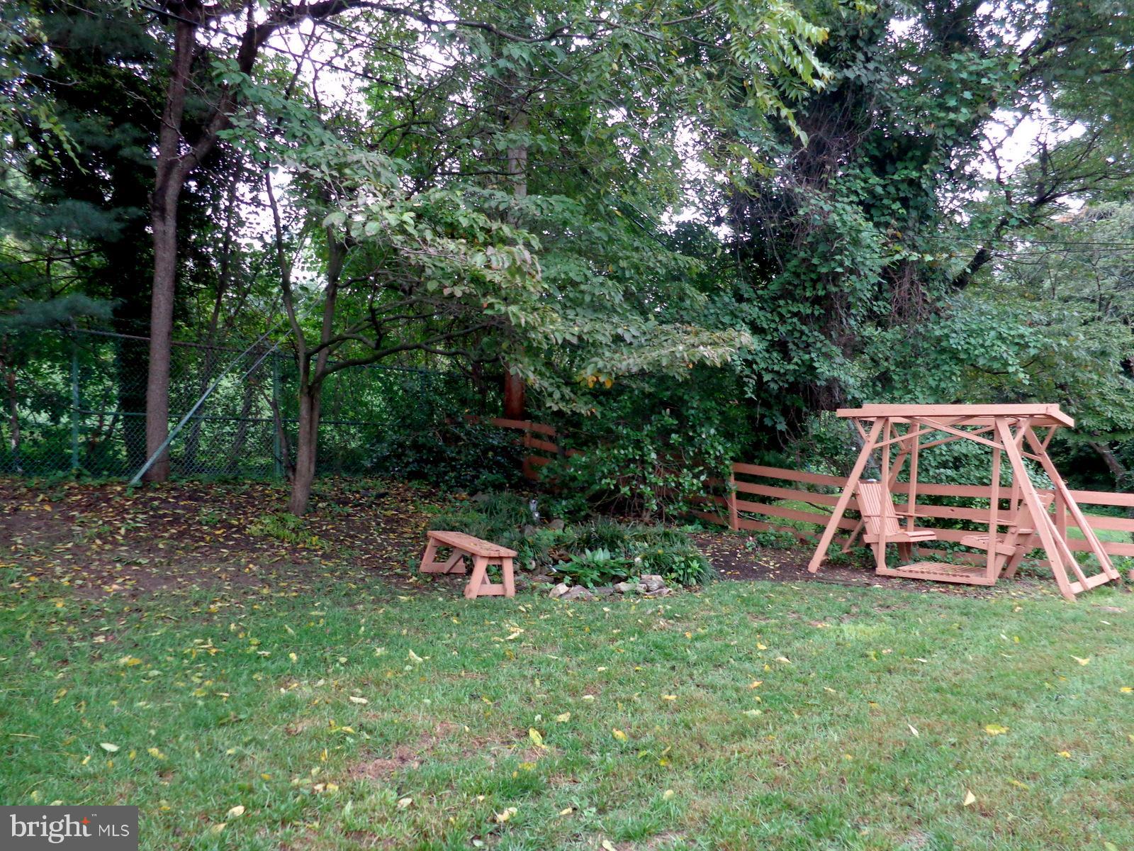561 Brook Road Towson, MD 21286 - Photo 25 of 27 Swing and small pond