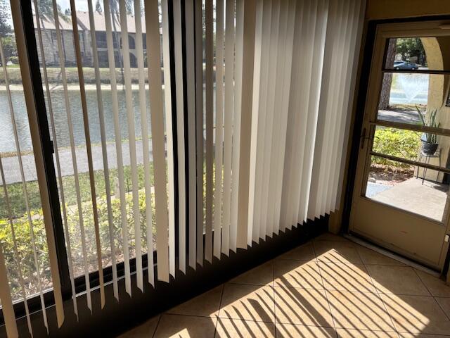 340 Pine Ridge Circle, Unit B1 Greenacres, FL 33463 - Photo 12 of 21 a view of a balcony with wooden floor and windows