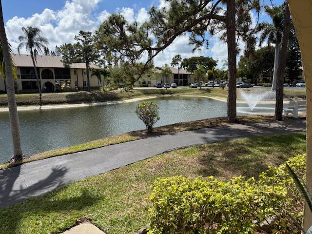 340 Pine Ridge Circle, Unit B1 Greenacres, FL 33463 - Photo 13 of 21 a view of a lake with houses