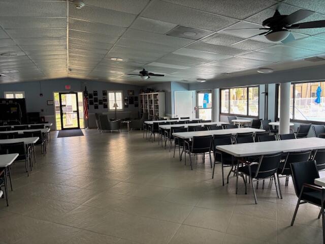 340 Pine Ridge Circle, Unit B1 Greenacres, FL 33463 - Photo 15 of 21 a group of people sitting at tables in a room