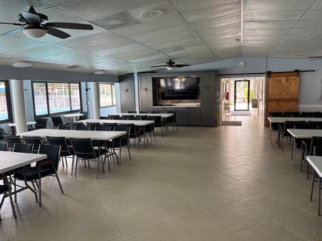 340 Pine Ridge Circle, Unit B1 Greenacres, FL 33463 - Photo 18 of 21 a view of a dining room with furniture window and wooden floor