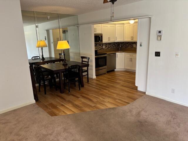 340 Pine Ridge Circle, Unit B1 Greenacres, FL 33463 - Photo 3 of 21 a view of kitchen with dining table and stainless steel appliances