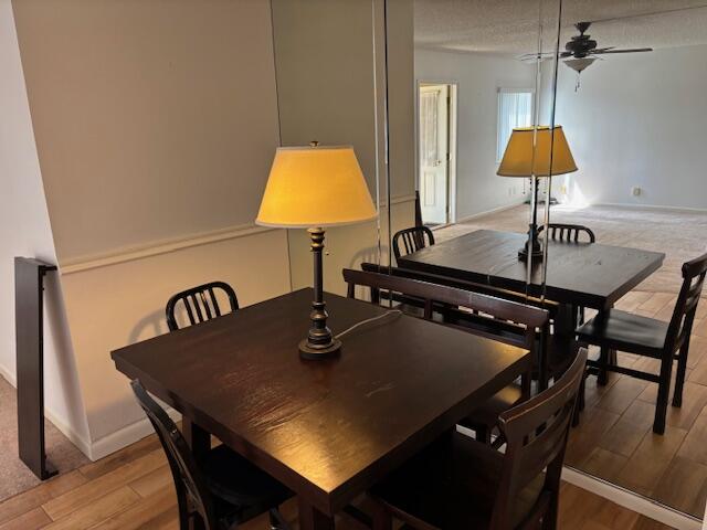 340 Pine Ridge Circle, Unit B1 Greenacres, FL 33463 - Photo 6 of 21 a kitchen with a table and chairs