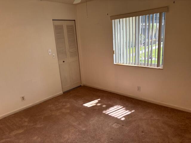 340 Pine Ridge Circle, Unit B1 Greenacres, FL 33463 - Photo 7 of 21 a view of an empty room with a window