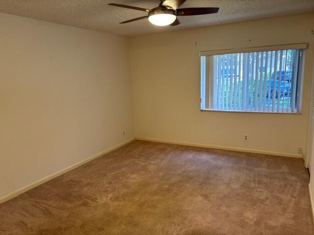 340 Pine Ridge Circle, Unit B1 Greenacres, FL 33463 - Photo 8 of 21 an empty room with a window