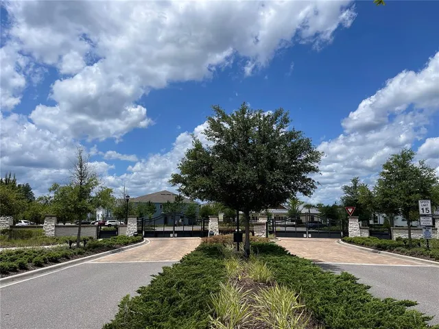 a view of swimming pool is middle in the garden
