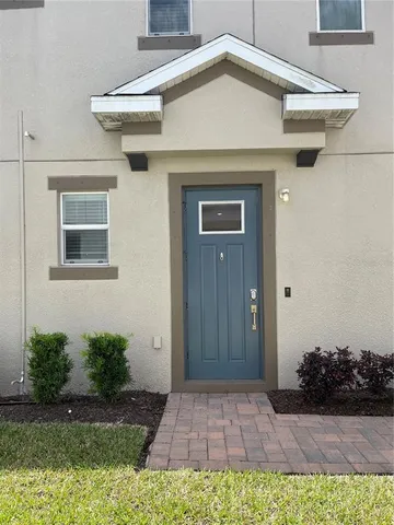 a view of a house with a small yard