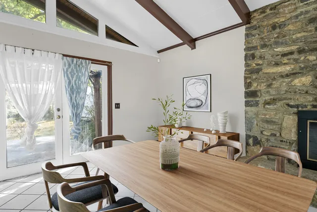 a view of a dining room with furniture window and outside view