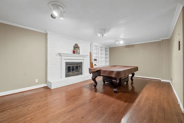 a view of a livingroom with furniture and a fireplace