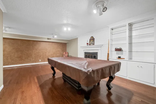 a spacious bedroom with a bed and a fireplace