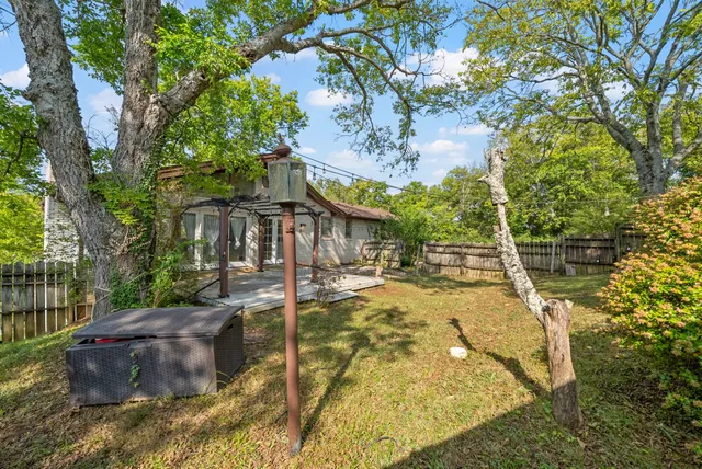 a view of a swimming pool with a patio