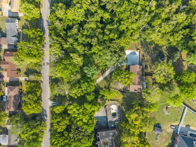 a view of a small house with a yard