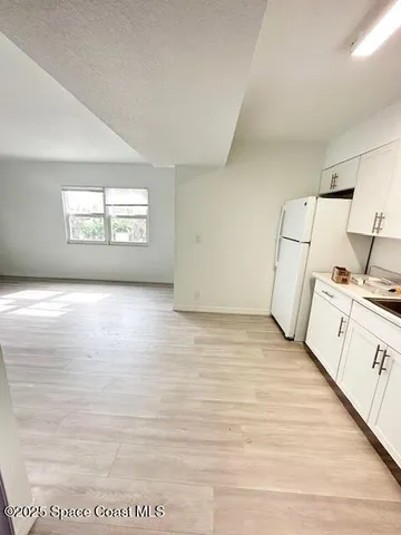 a view of a kitchen with a sink and a dishwasher