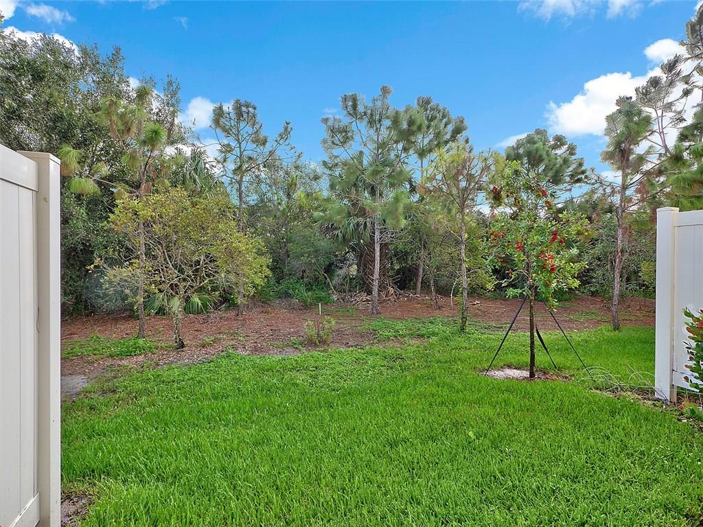 3055 Southwest Otter Lane Stuart, FL 34997 - Photo 11 of 13 a view of a park with a tree in the background
