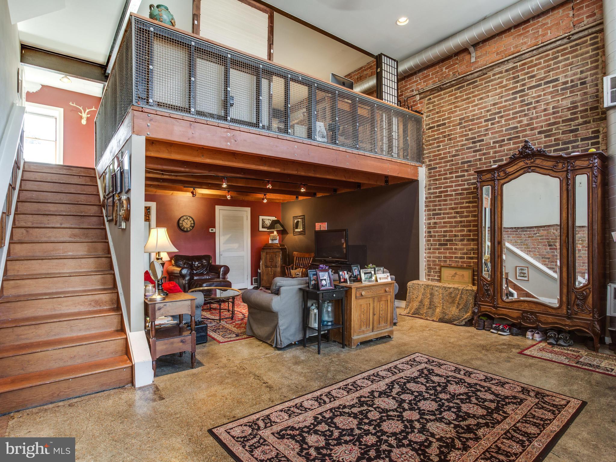 1954 Calvert Street Northwest Washington, DC 20009 - Photo 2 of 30 Unit A Loft w/Soaring 16'+ Ceilings, Exposed Brick