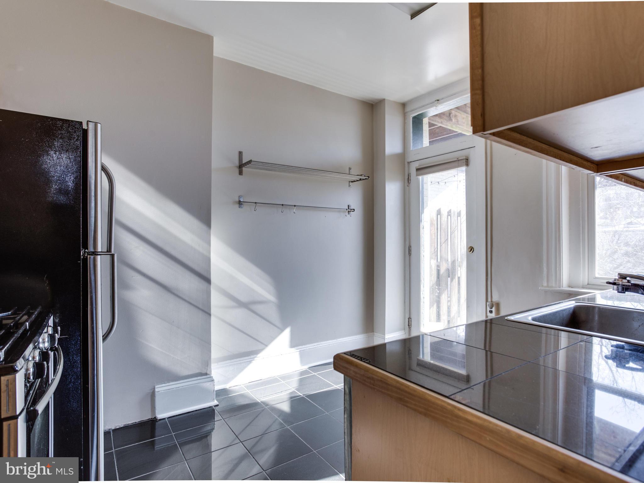 1954 Calvert Street Northwest Washington, DC 20009 - Photo 20 of 30 Unit 1 Kitchen Opens to South-Facing Balcony
