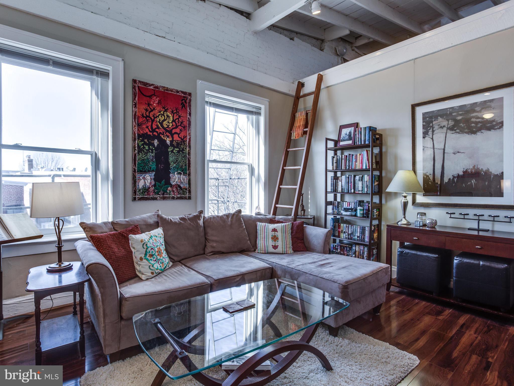 1954 Calvert Street Northwest Washington, DC 20009 - Photo 9 of 30 Unit 2 Living Room, Big Windows, Ladder to Loft