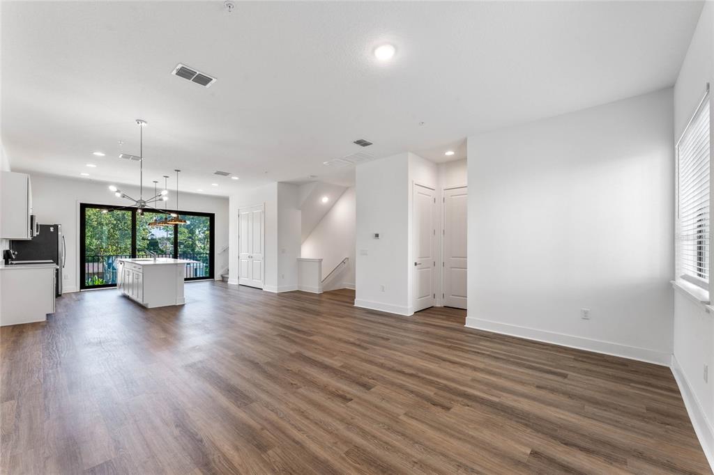 38 West Harding Street, Unit C Orlando, FL 32806 - Photo 12 of 32 a view of a living room a kitchen and a wooden floor
