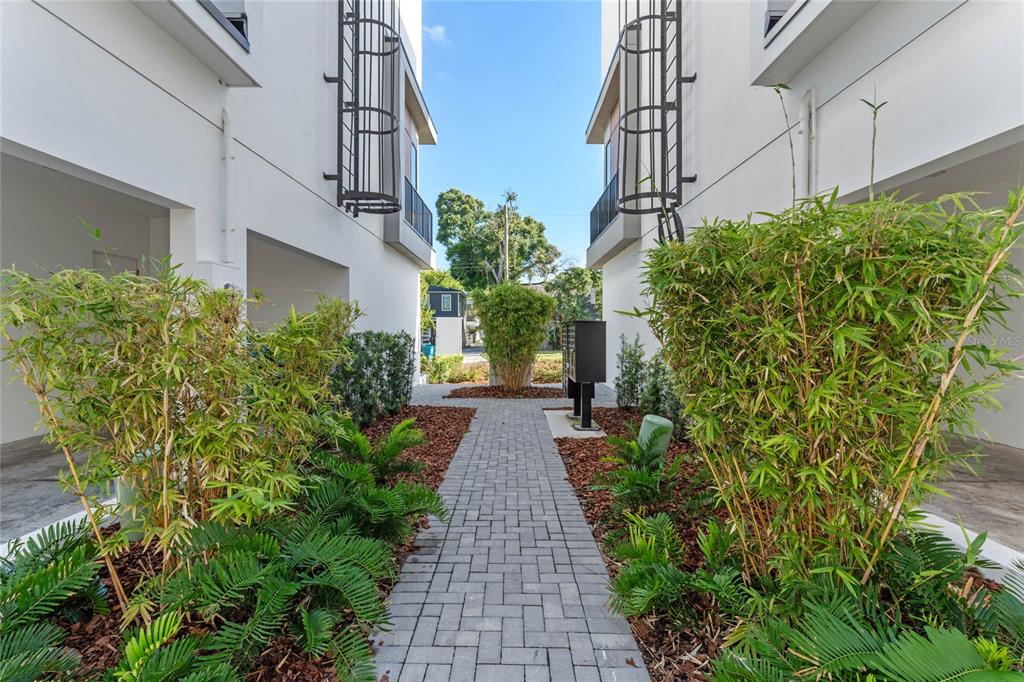 38 West Harding Street, Unit C Orlando, FL 32806 - Photo 27 of 32 a view of a pathway with house on both side