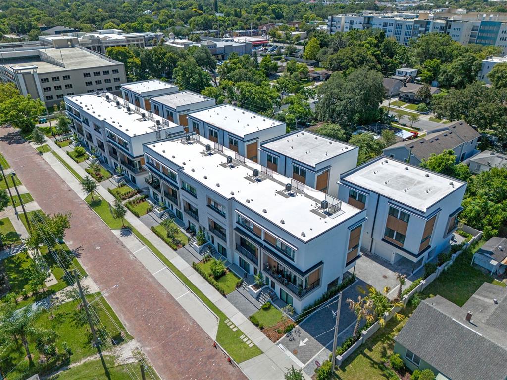 38 West Harding Street, Unit C Orlando, FL 32806 - Photo 30 of 32 an aerial view of a multi story parking building with yard and mountain view in back