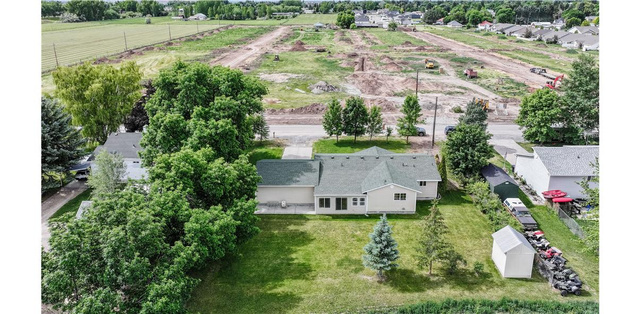 435 East 4th North Preston, ID 83263 - Photo 20 of 26 Single-story residence featuring a light-colored exterior and a dark green shingle roof