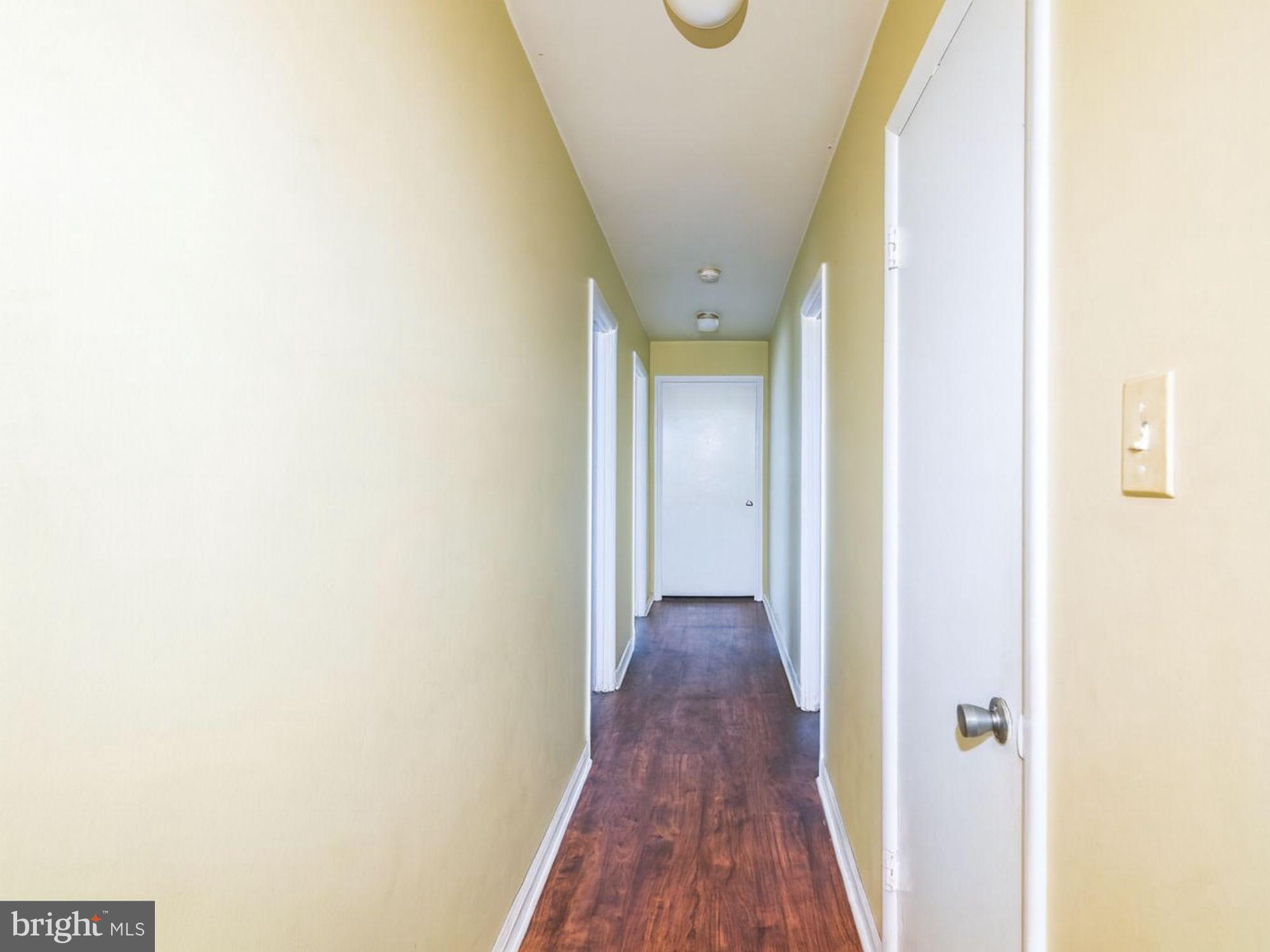 15708 Dorset Road, Unit 177 Laurel, MD 20707 - Photo 22 of 25 a view of a hallway with wooden floor