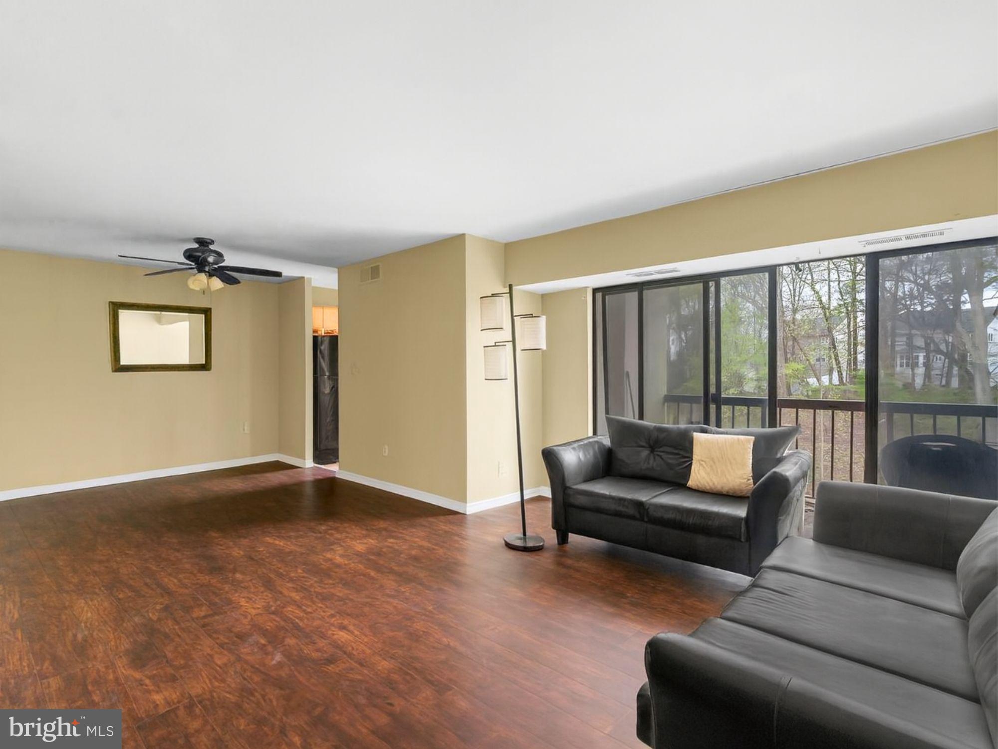 15708 Dorset Road, Unit 177 Laurel, MD 20707 - Photo 6 of 25 a living room with furniture and a large window