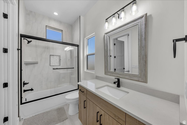 404 North Marsala Way St. George, UT 84770 - Photo 11 of 26 Full bathroom featuring vanity and shower / bath combination with glass door
