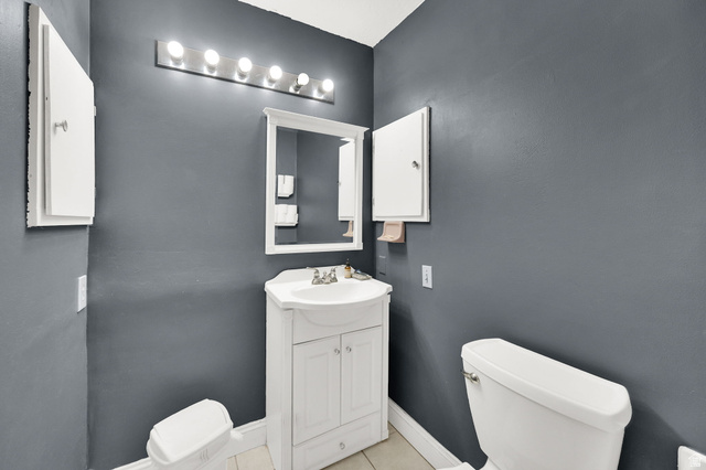 4635 Box Elder Street Murray, UT 84107 - Photo 17 of 21 Bathroom featuring vanity and light tile patterned floors