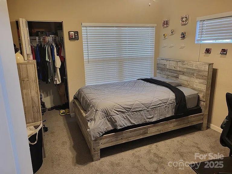 897 Fording Island Road, Unit 2208 Bluffton, SC 29910 - Photo 11 of 29 a bedroom with a bed and a walk in closet