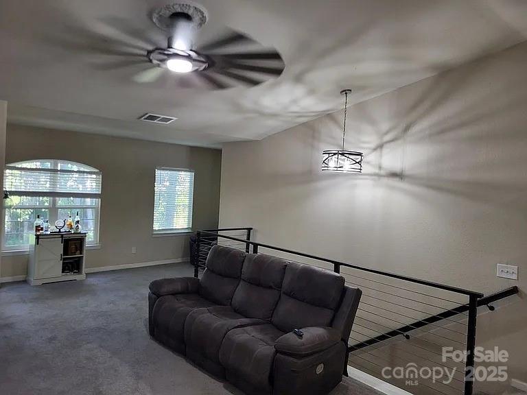 897 Fording Island Road, Unit 2208 Bluffton, SC 29910 - Photo 13 of 29 a living room with furniture and window