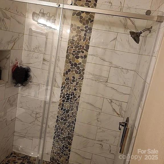 897 Fording Island Road, Unit 2208 Bluffton, SC 29910 - Photo 18 of 29 a bathroom with a shower