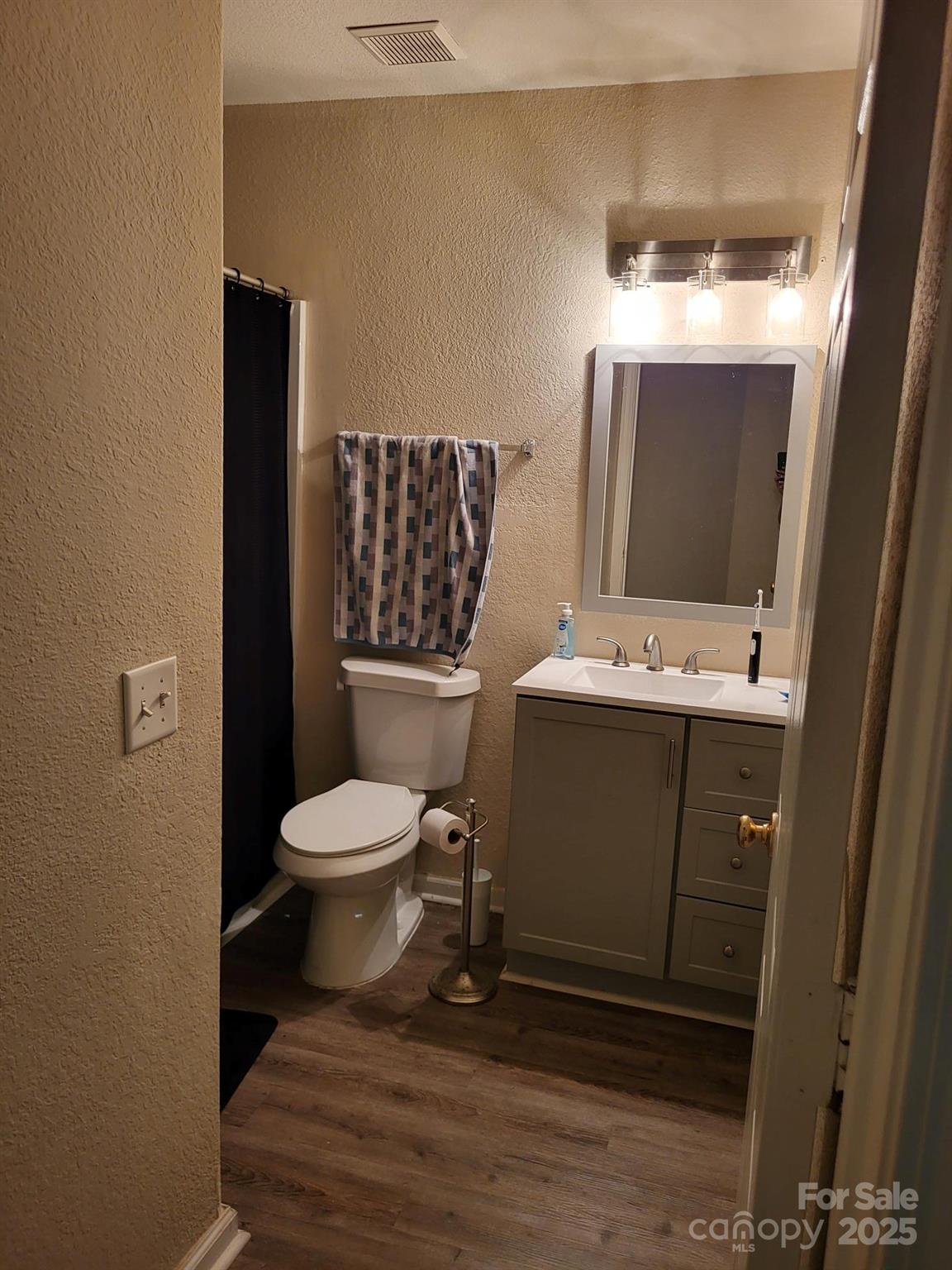 897 Fording Island Road, Unit 2208 Bluffton, SC 29910 - Photo 21 of 29 a bathroom with a toilet sink and mirror