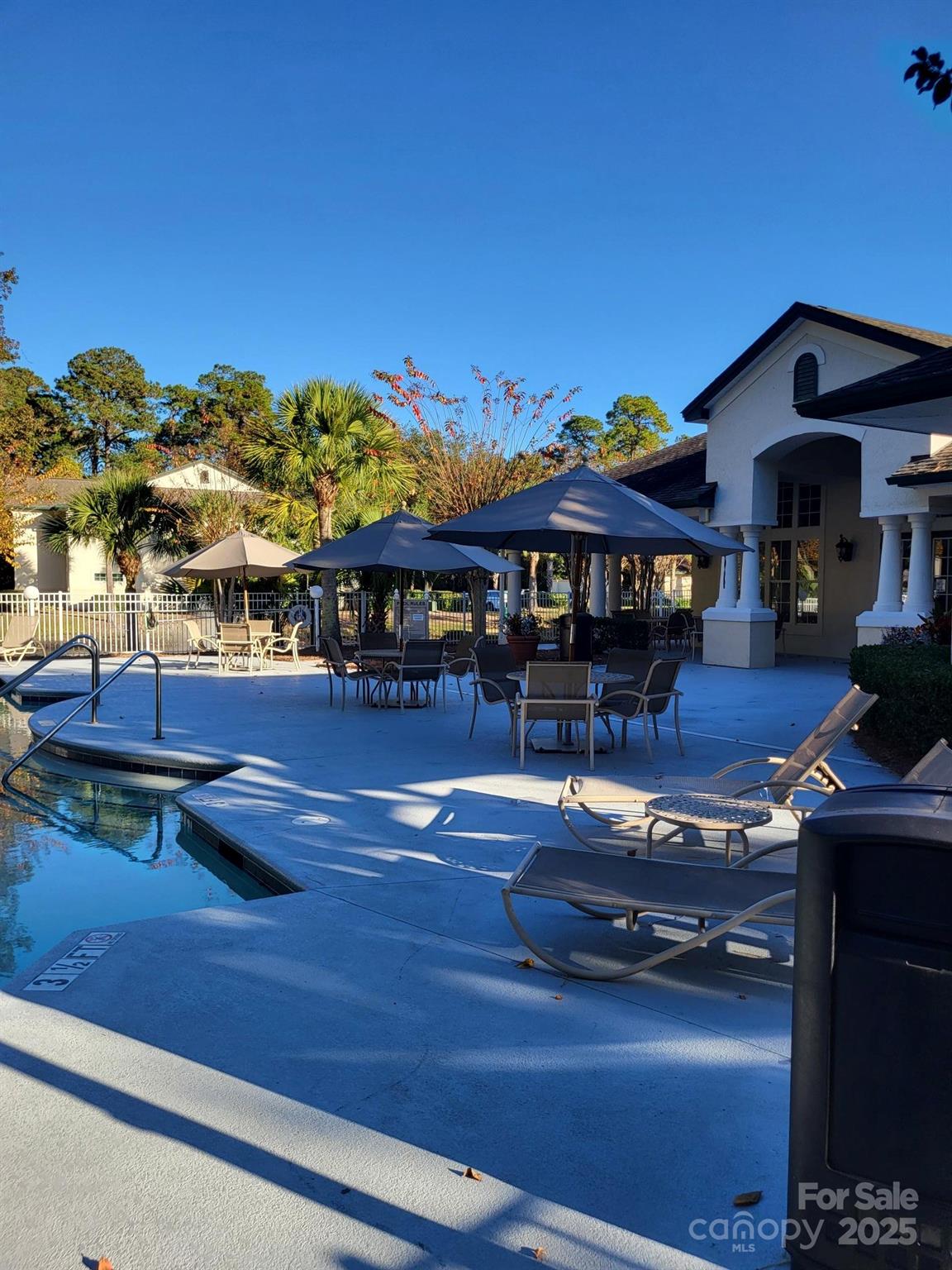 897 Fording Island Road, Unit 2208 Bluffton, SC 29910 - Photo 27 of 29 a front view of a house with yard swimming pool and outdoor seating
