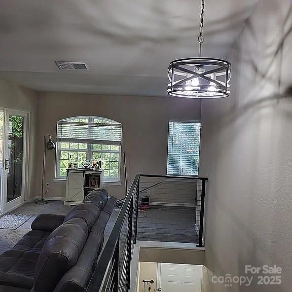 897 Fording Island Road, Unit 2208 Bluffton, SC 29910 - Photo 5 of 29 a living room with couches chandelier and a fireplace
