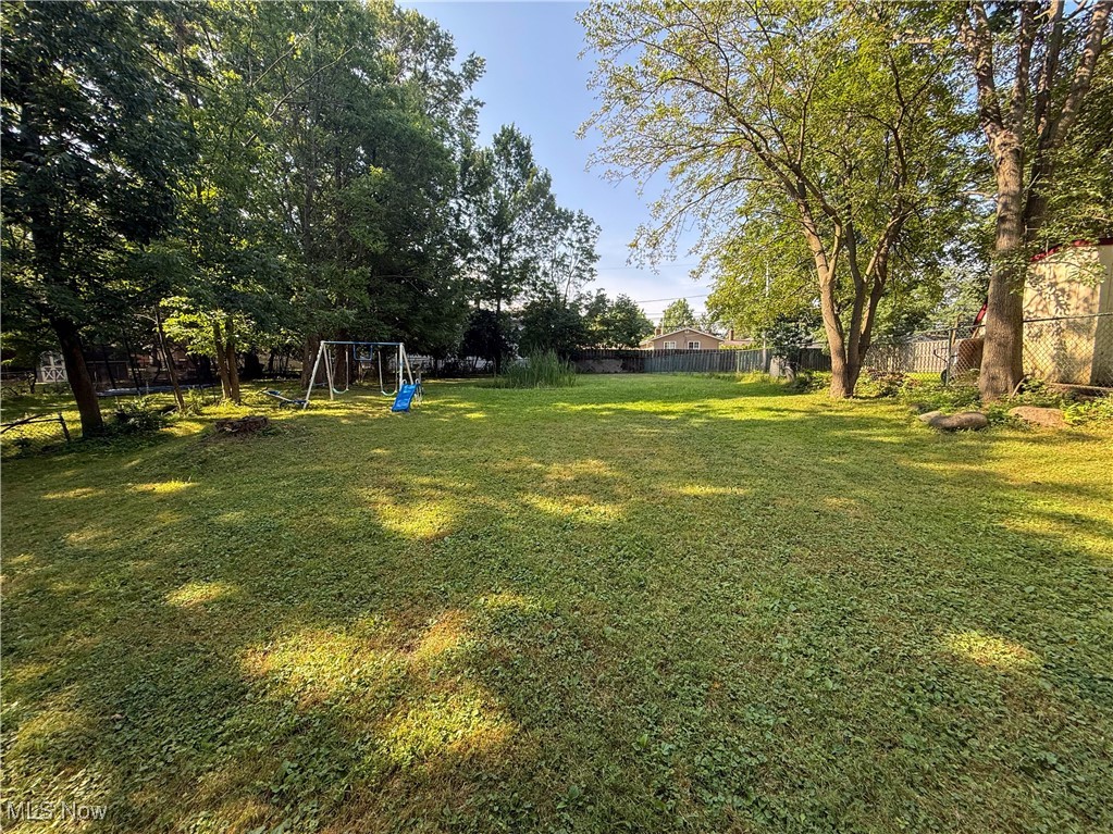 4672 Liberty Road South Euclid, OH 44121 - Photo 20 of 23 Fenced backyard featuring a playground