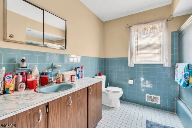 a kitchen with a sink a stove and cabinets