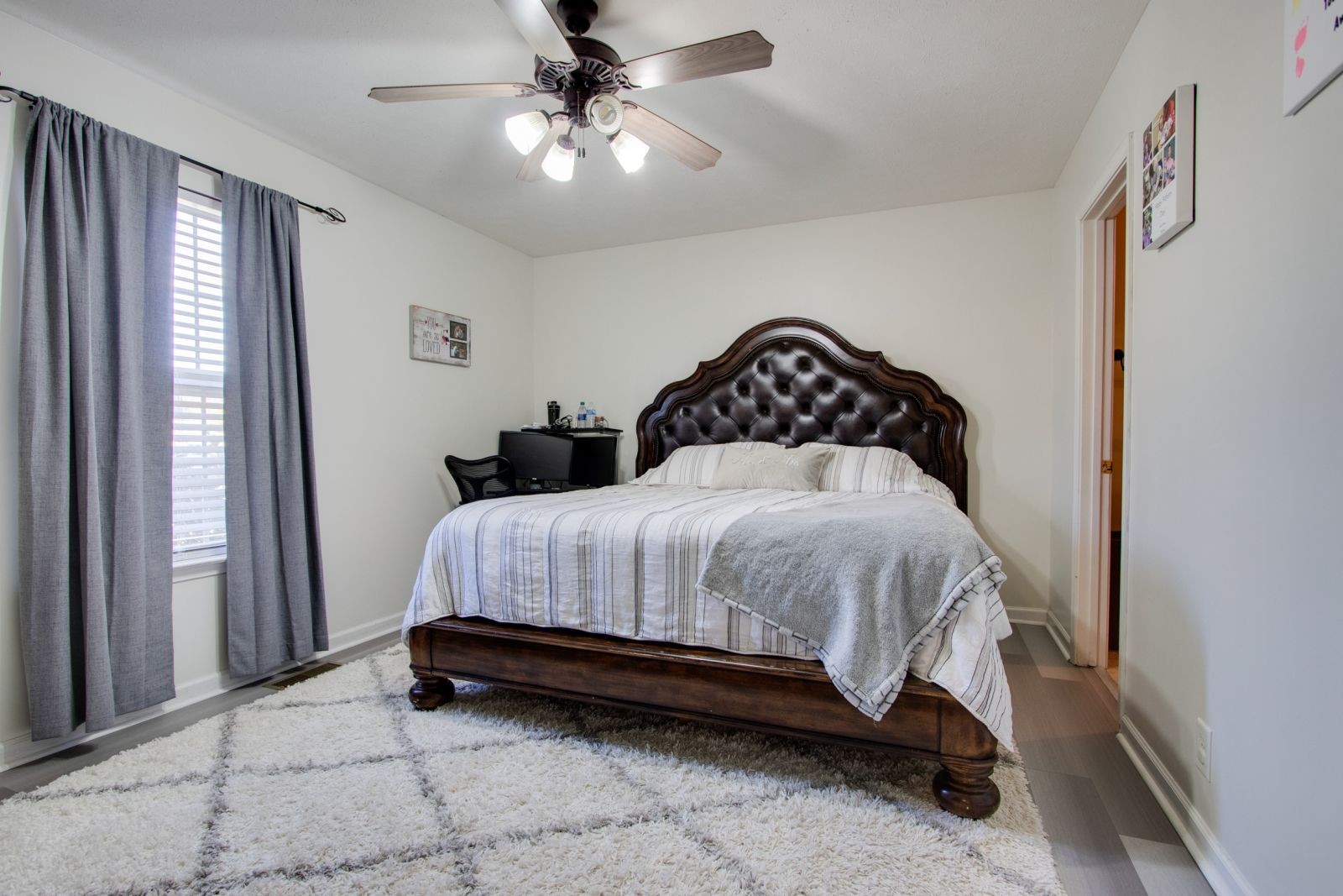 76 Fite Road Watertown, TN 37184 - Photo 11 of 19 a bedroom with a bed and a chandelier