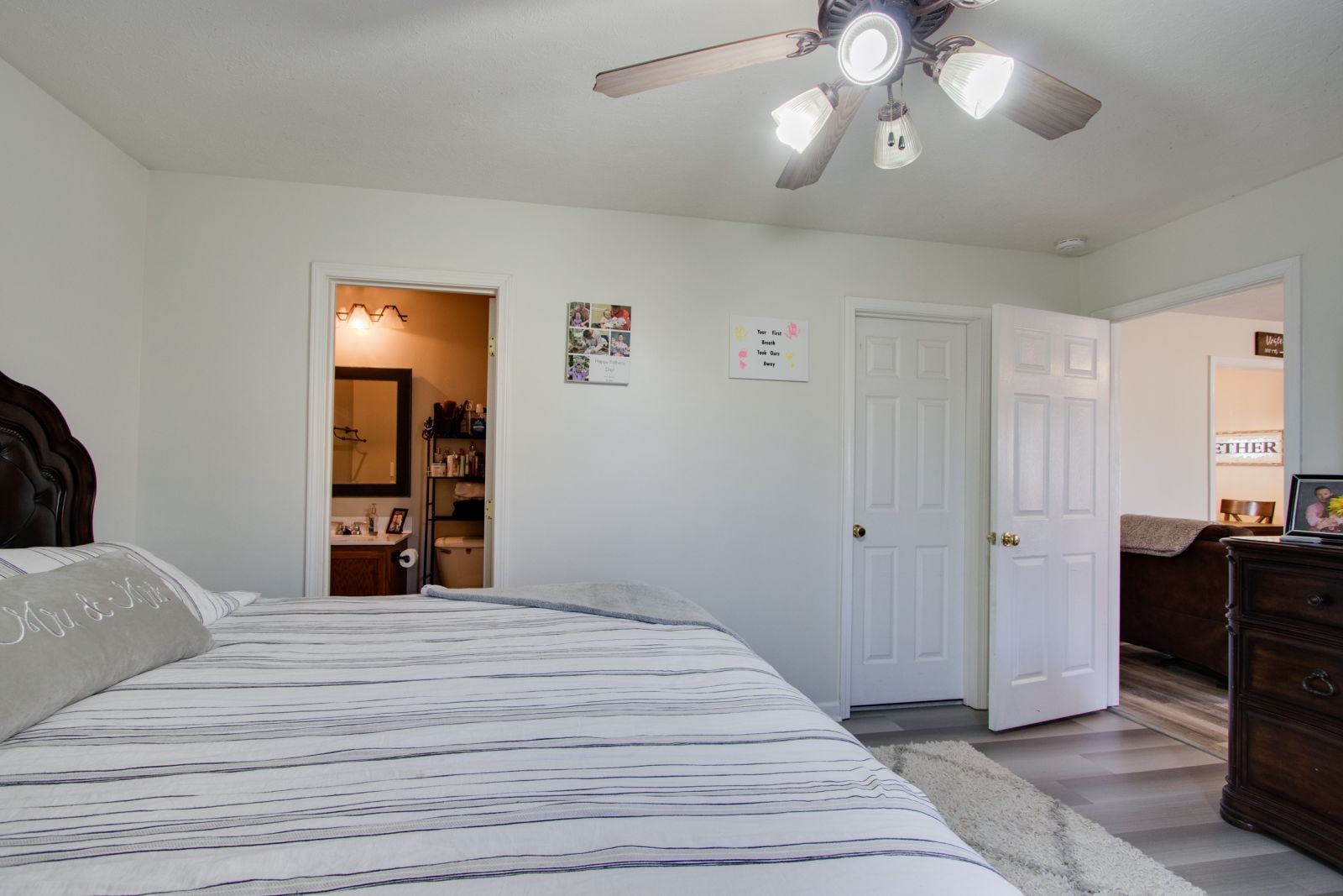76 Fite Road Watertown, TN 37184 - Photo 12 of 19 a bedroom with a bed and a chandelier