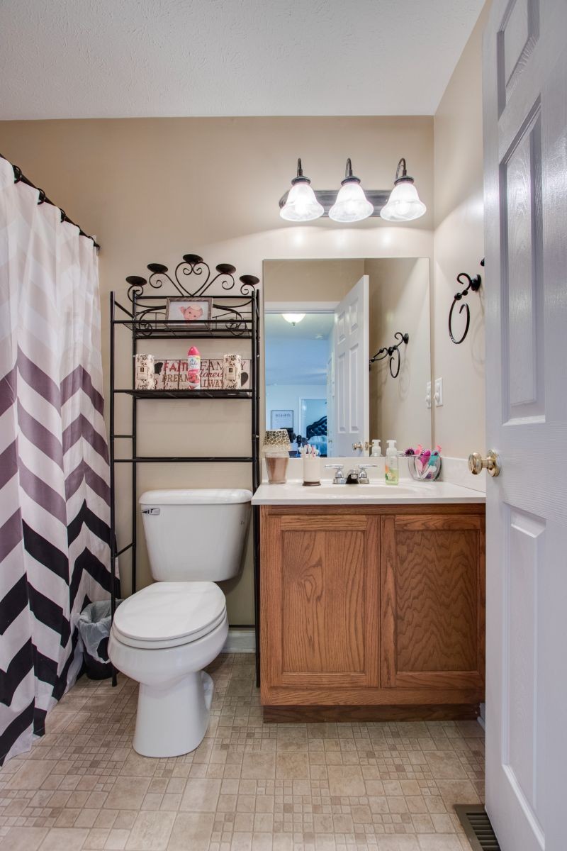76 Fite Road Watertown, TN 37184 - Photo 16 of 19 a bathroom with a toilet sink vanity and mirror