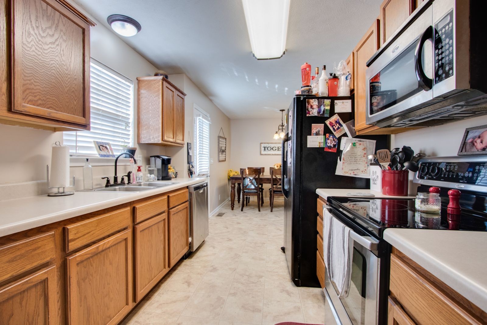 76 Fite Road Watertown, TN 37184 - Photo 8 of 19 a kitchen with stainless steel appliances granite countertop a sink and cabinets