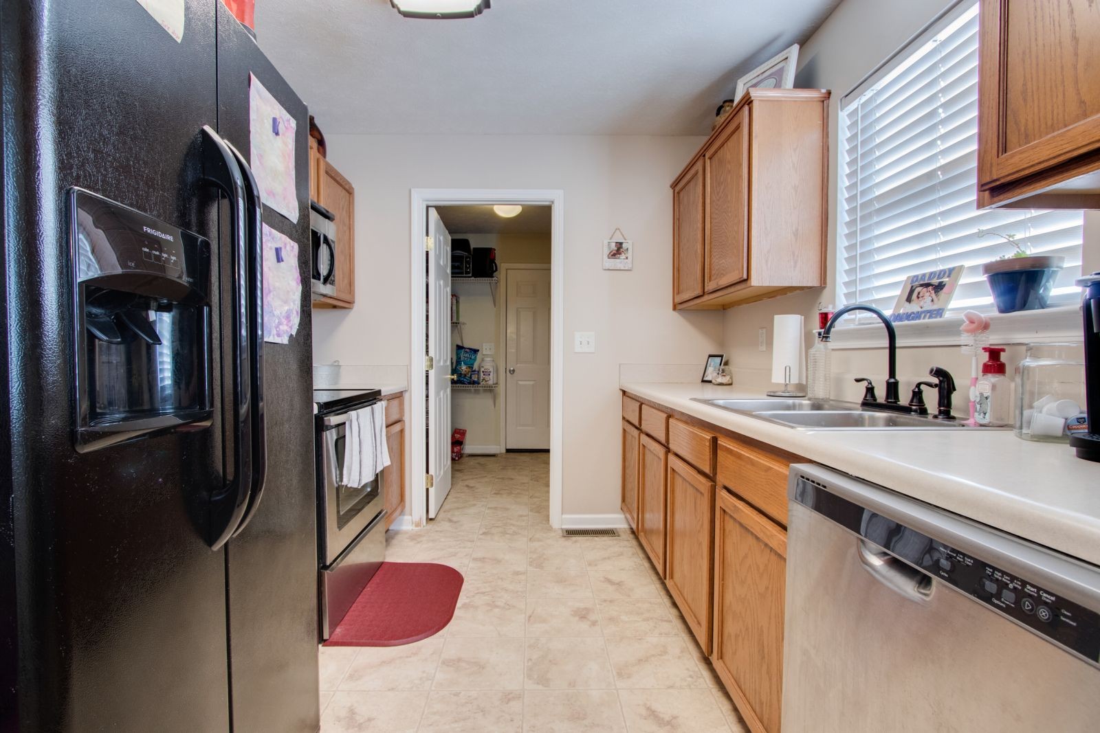 76 Fite Road Watertown, TN 37184 - Photo 9 of 19 a kitchen with stainless steel appliances granite countertop a refrigerator a stove and a sink