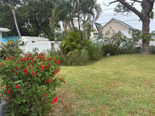 a view of a flower in front of a house