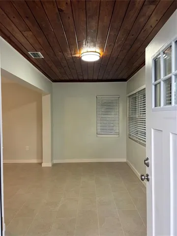 a view of an empty room with a window