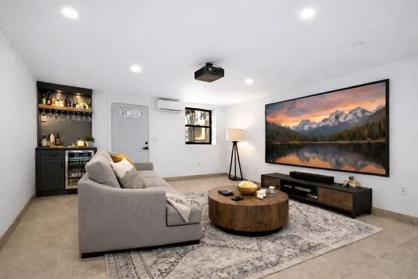 a living room with furniture and a flat screen tv