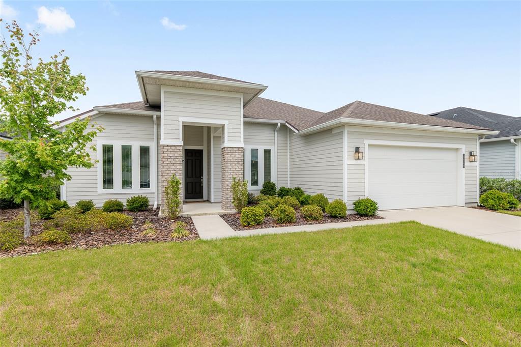 front view of a house with a yard